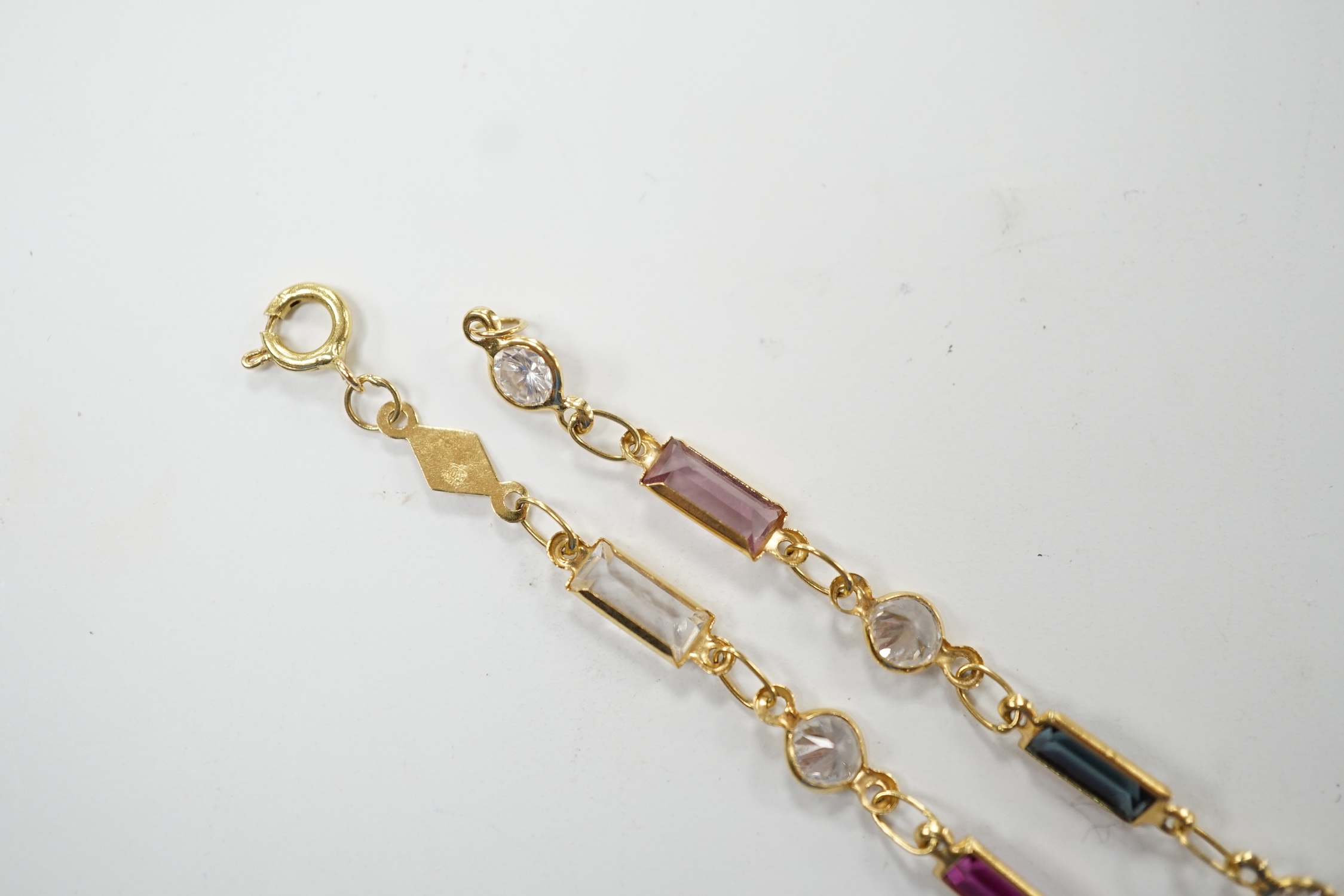 A modern 750 yellow metal and multi-gem set bracelet, 18.5cm, gross weight 2.7 grams. Fair condition